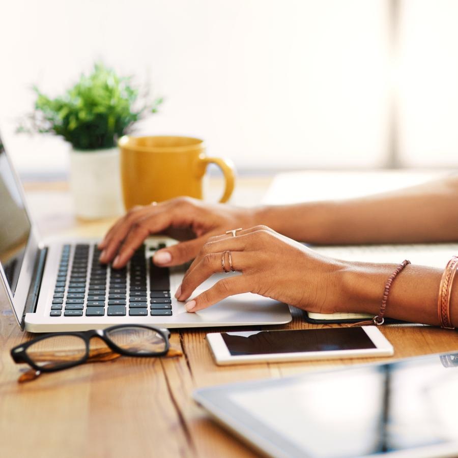 a person typing on a laptop